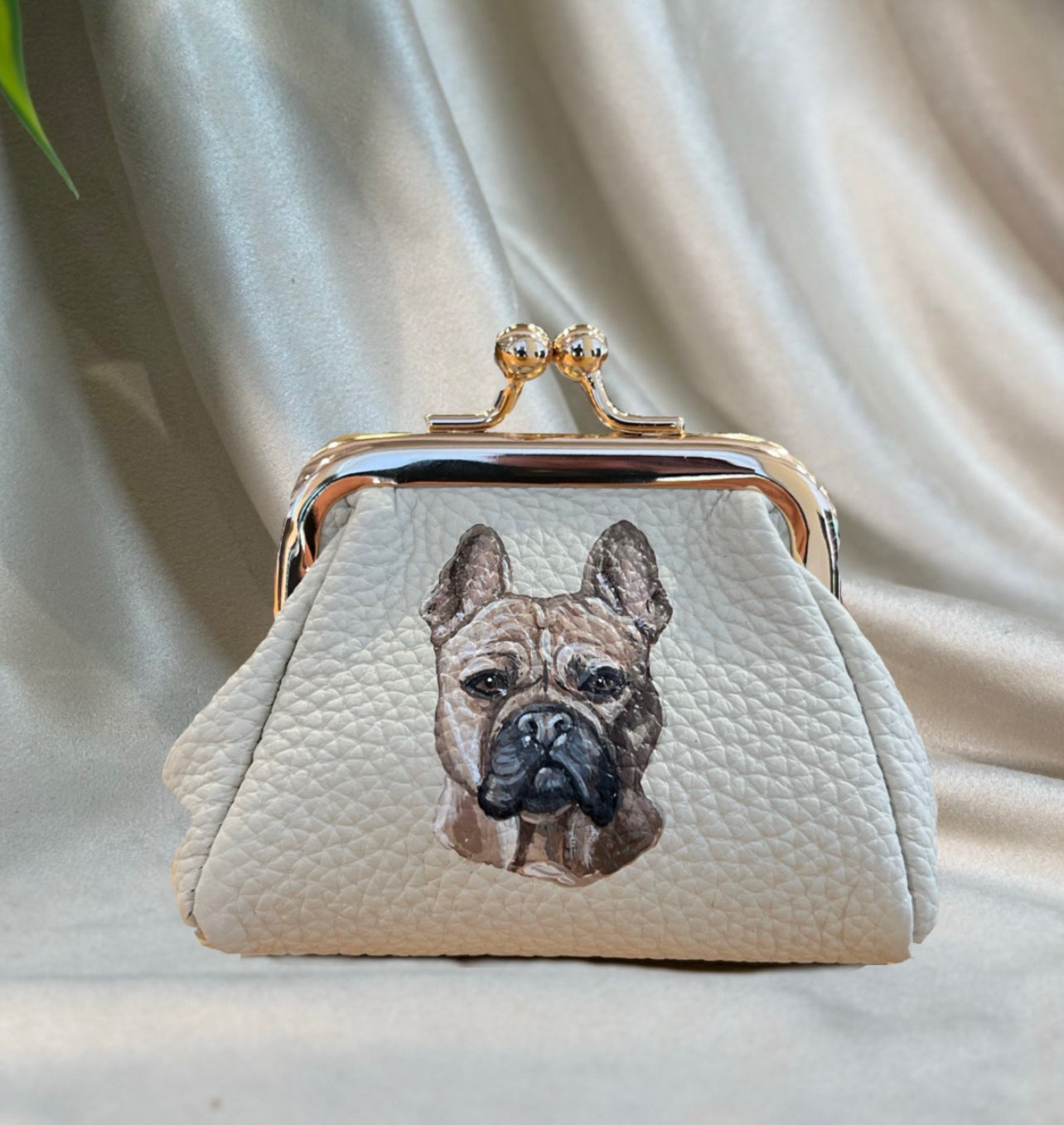 Pet portrait of a bulldog painted onto a change purse custom pouch. 
