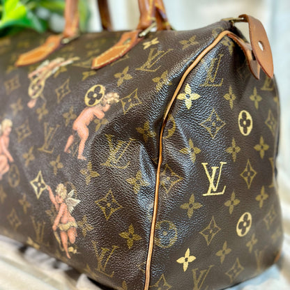 Designer handbag with monogram pattern on a neutral background