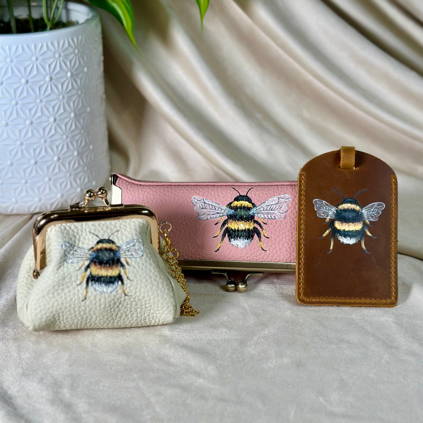 Set of three items with bee designs on a neutral background