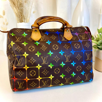 Designer handbag with multicolor pattern on a white surface