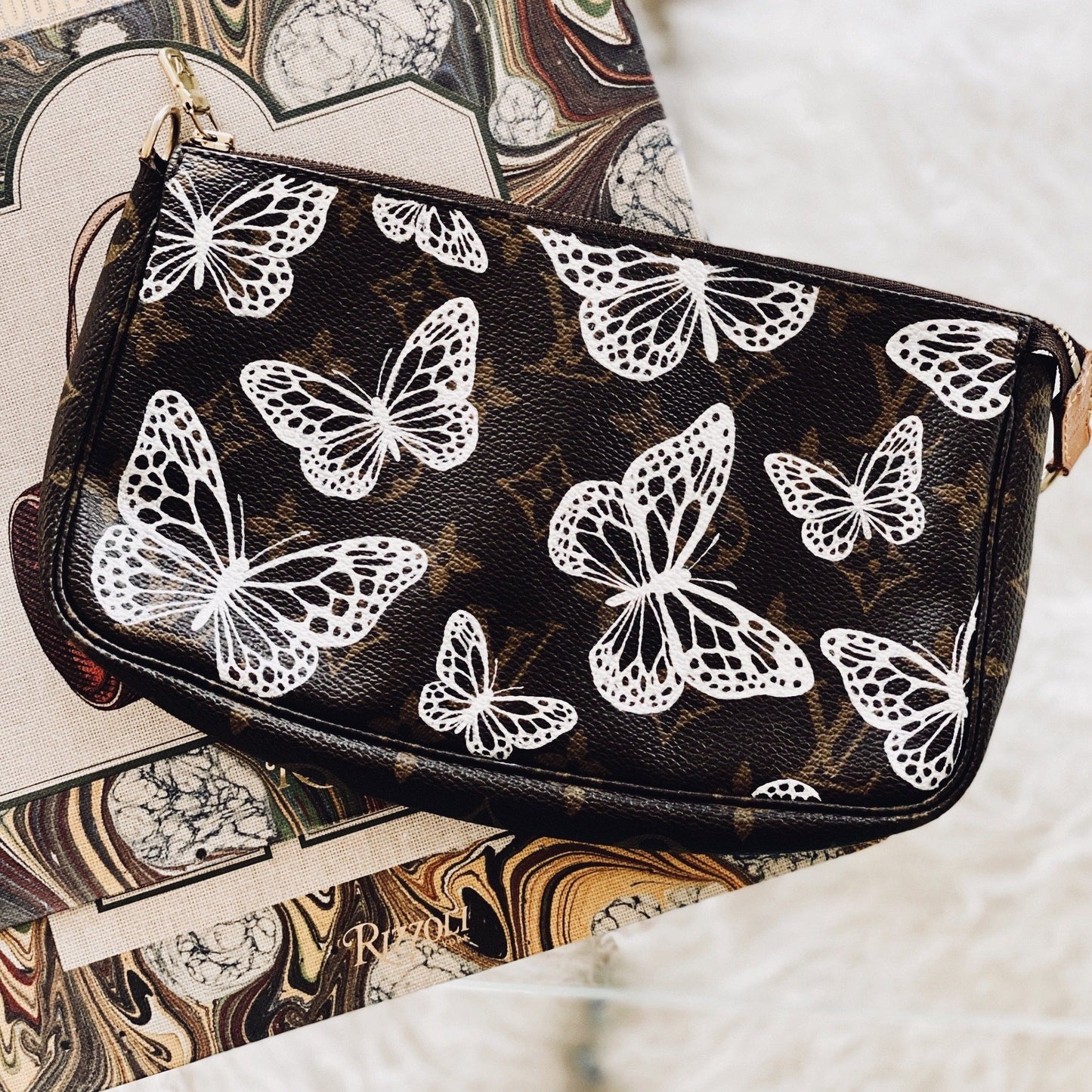 Butterflies in Lace Artwork, Painted on a Louis Vuitton Pouchette  by New Vintage